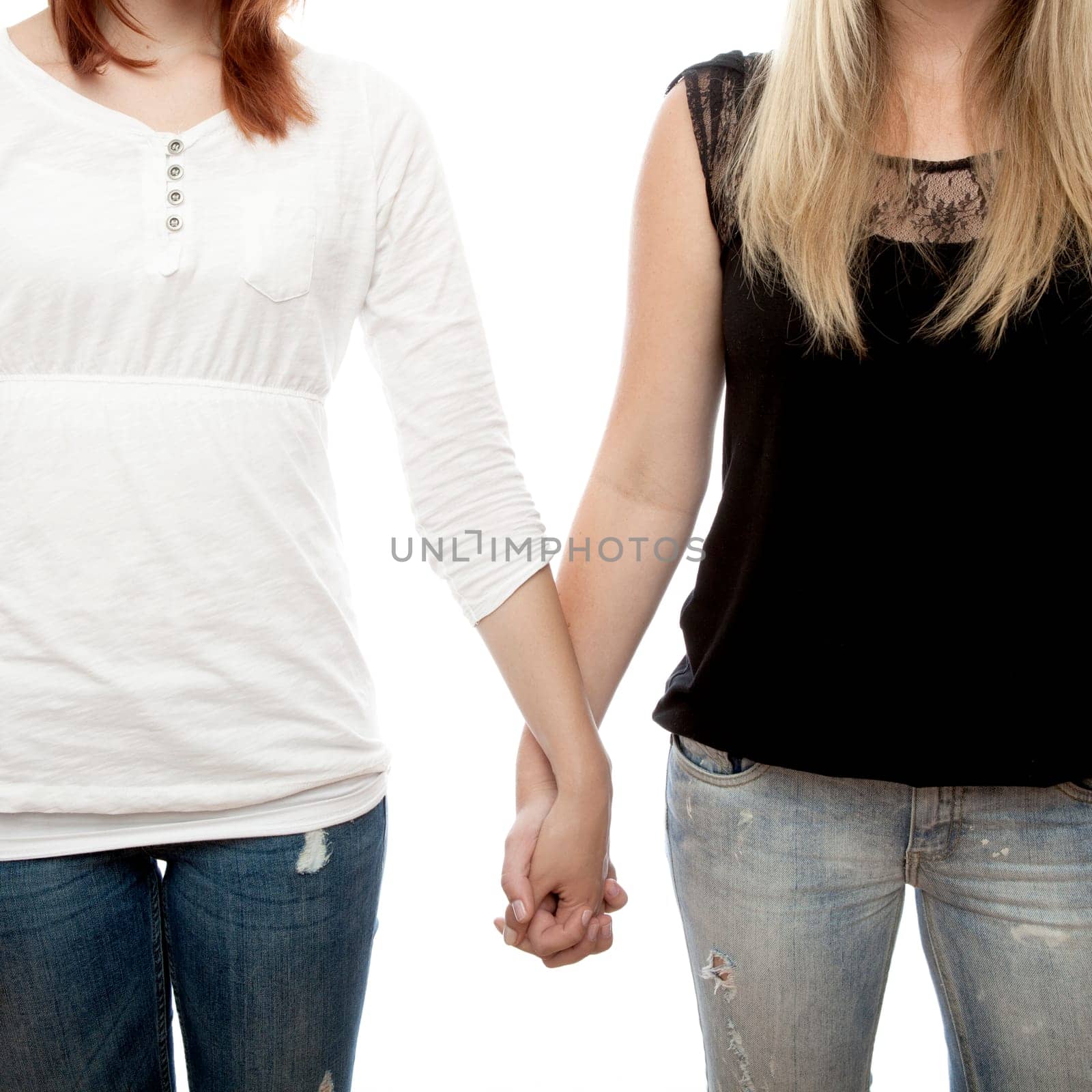 young beautiful red and blond haired girls in front of white background