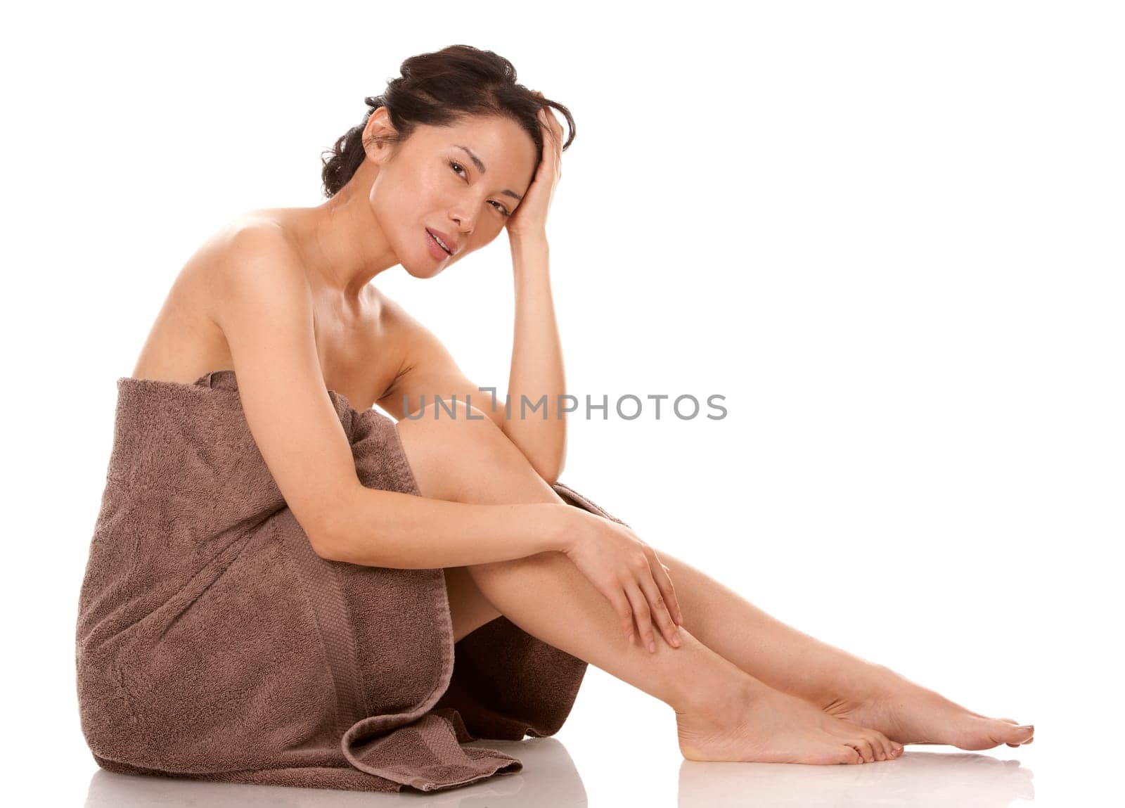 beautiful asian brunette nude on white isolated background