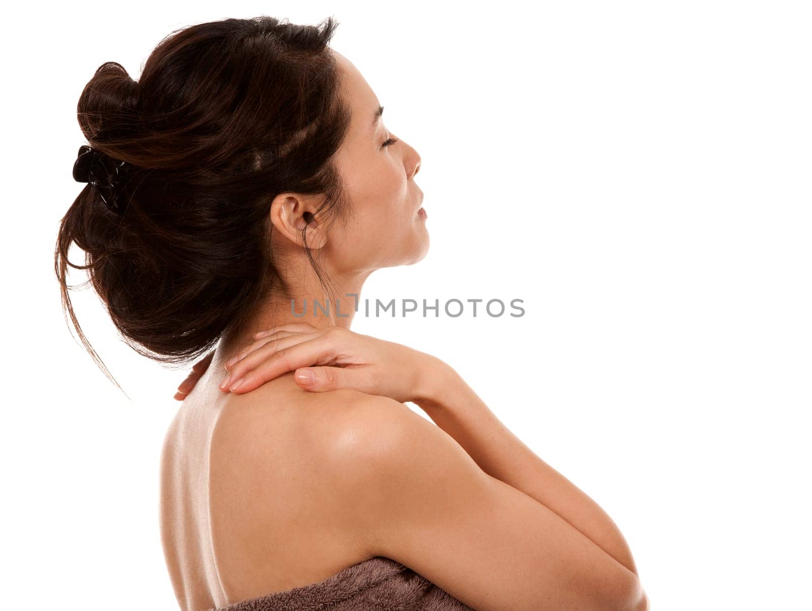 beautiful asian brunette nude on white isolated background