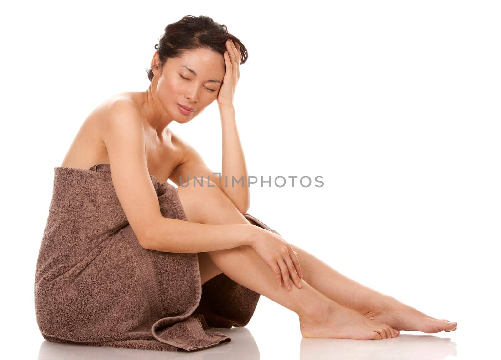 beautiful asian brunette nude on white isolated background