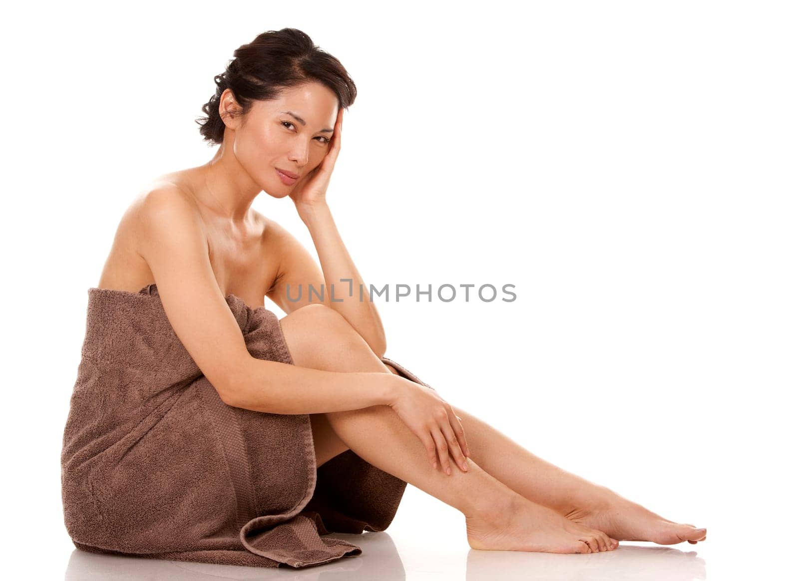 beautiful asian brunette nude on white isolated background