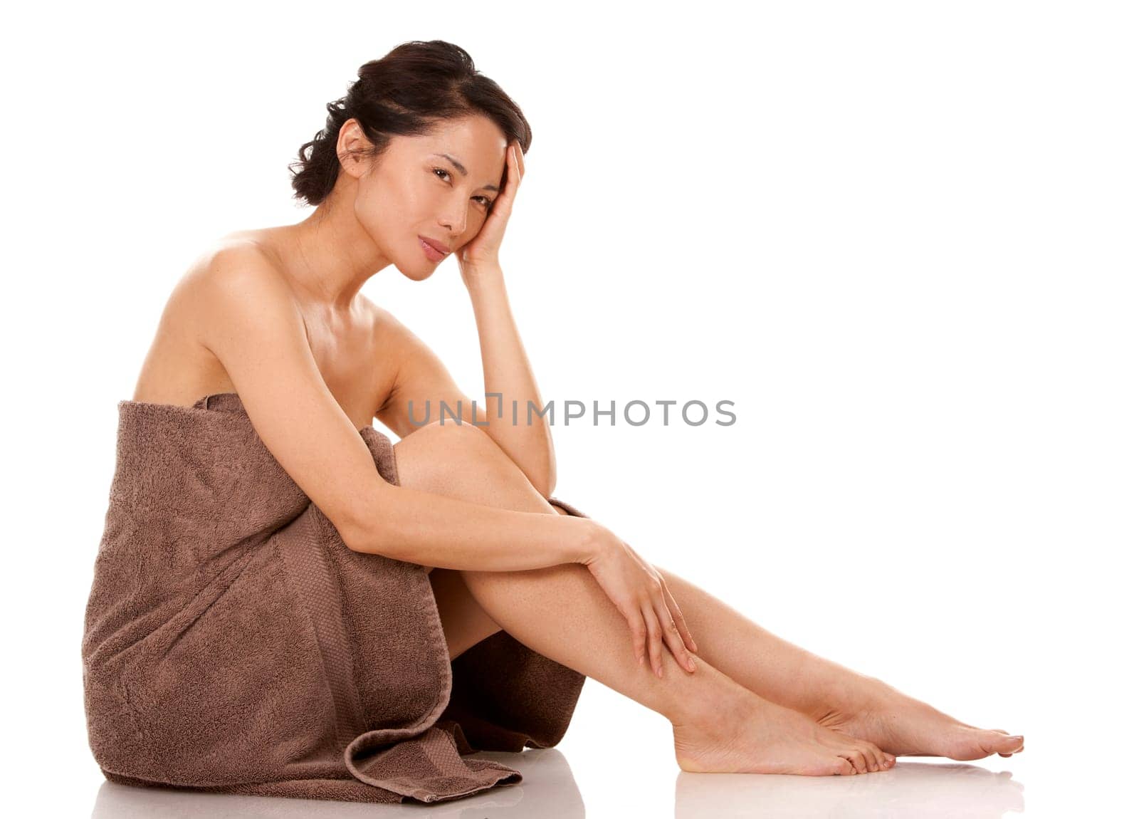 beautiful asian brunette nude on white isolated background