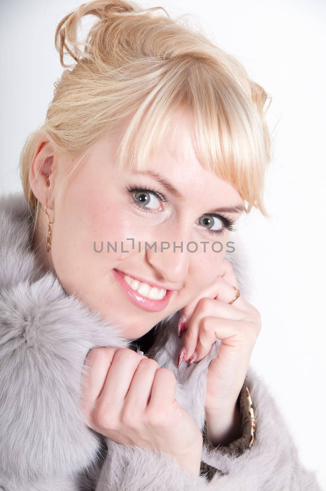 Portrait of beautiful smiling  woman in fur cardigan