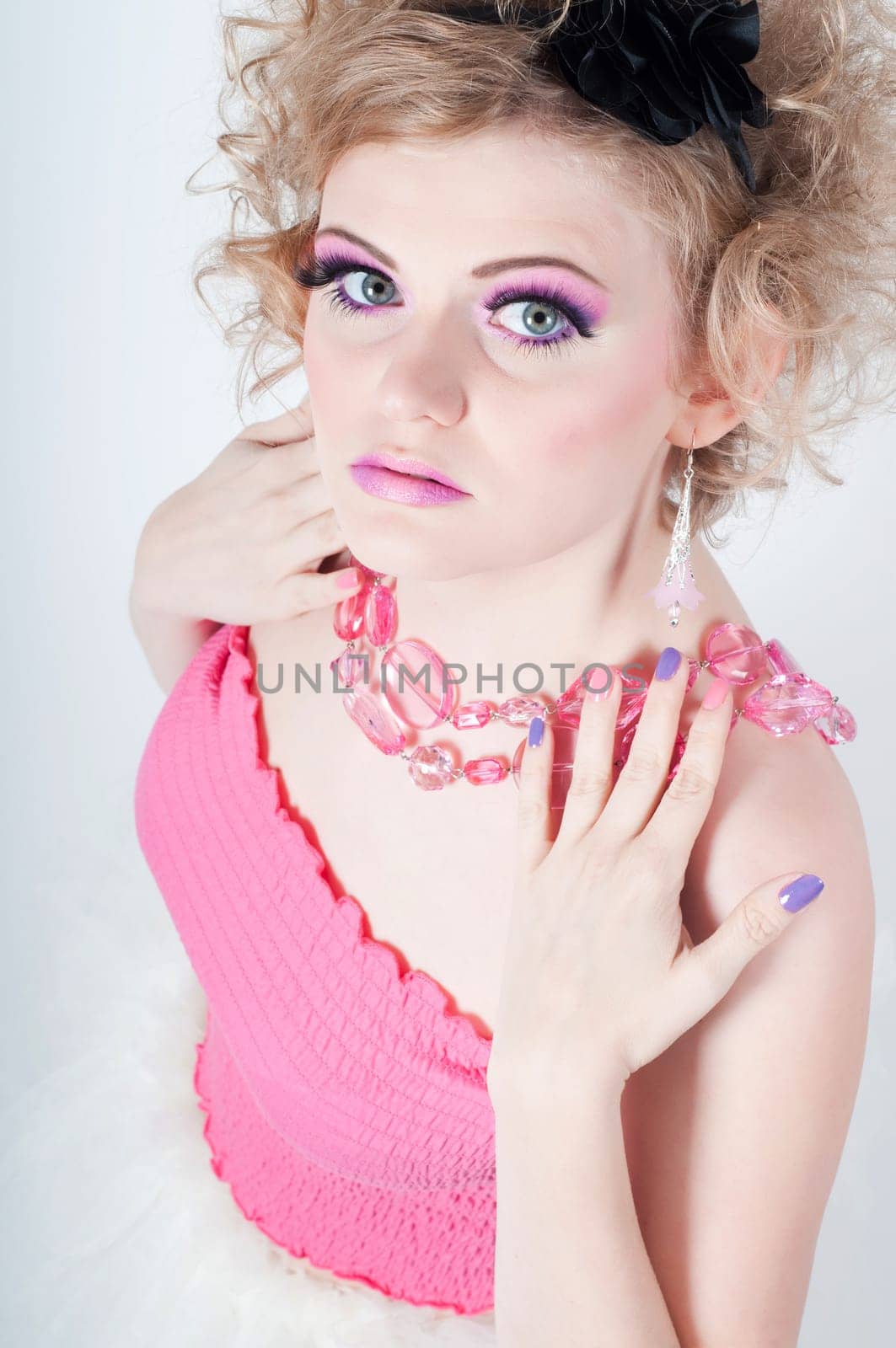 Portrait of young beautiful sexy tender blonde with fancy make-up