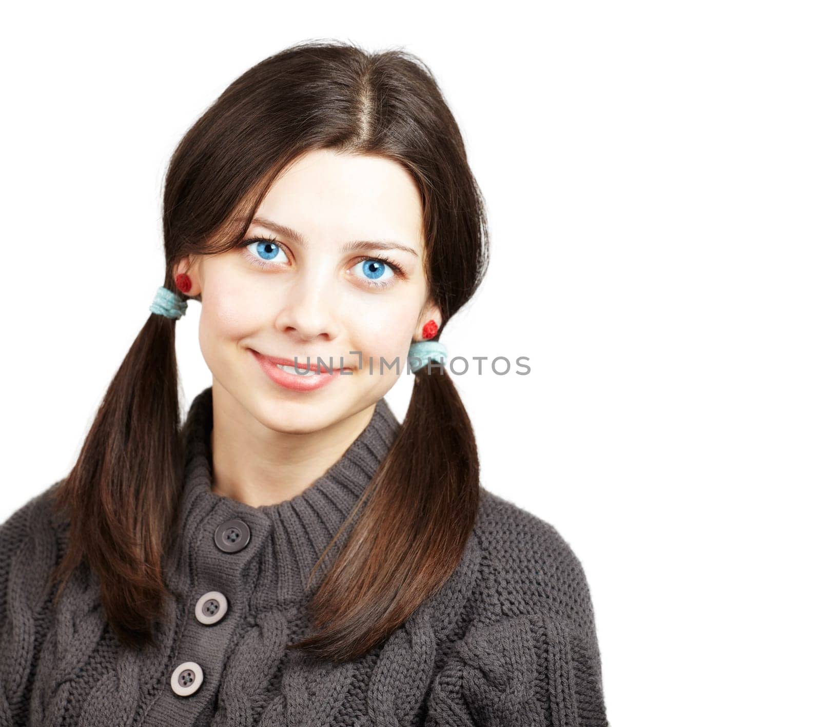 Portrait of a happy young brunette girl smiling.