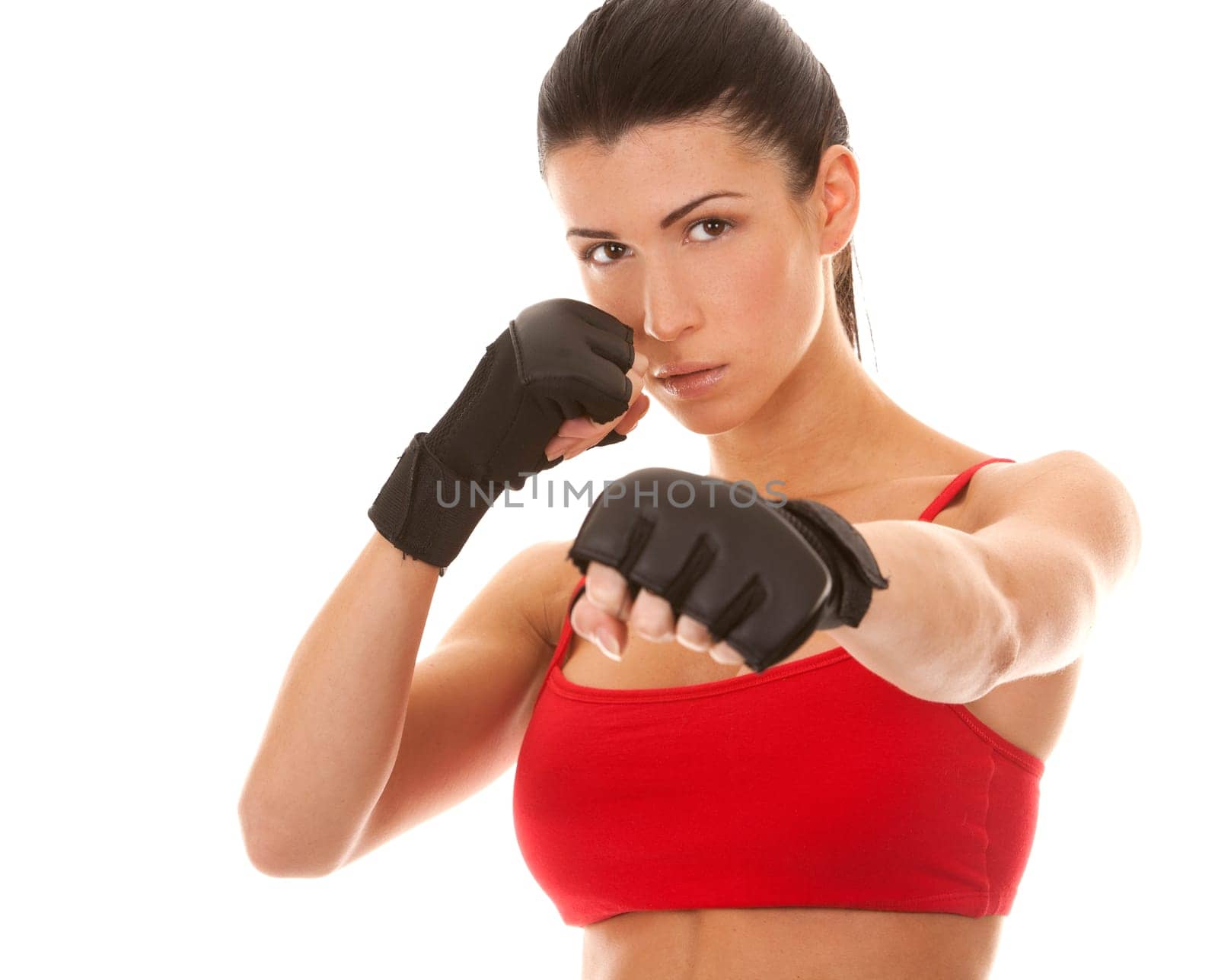 athletic brunette wearing boxing gloves on white isolated background