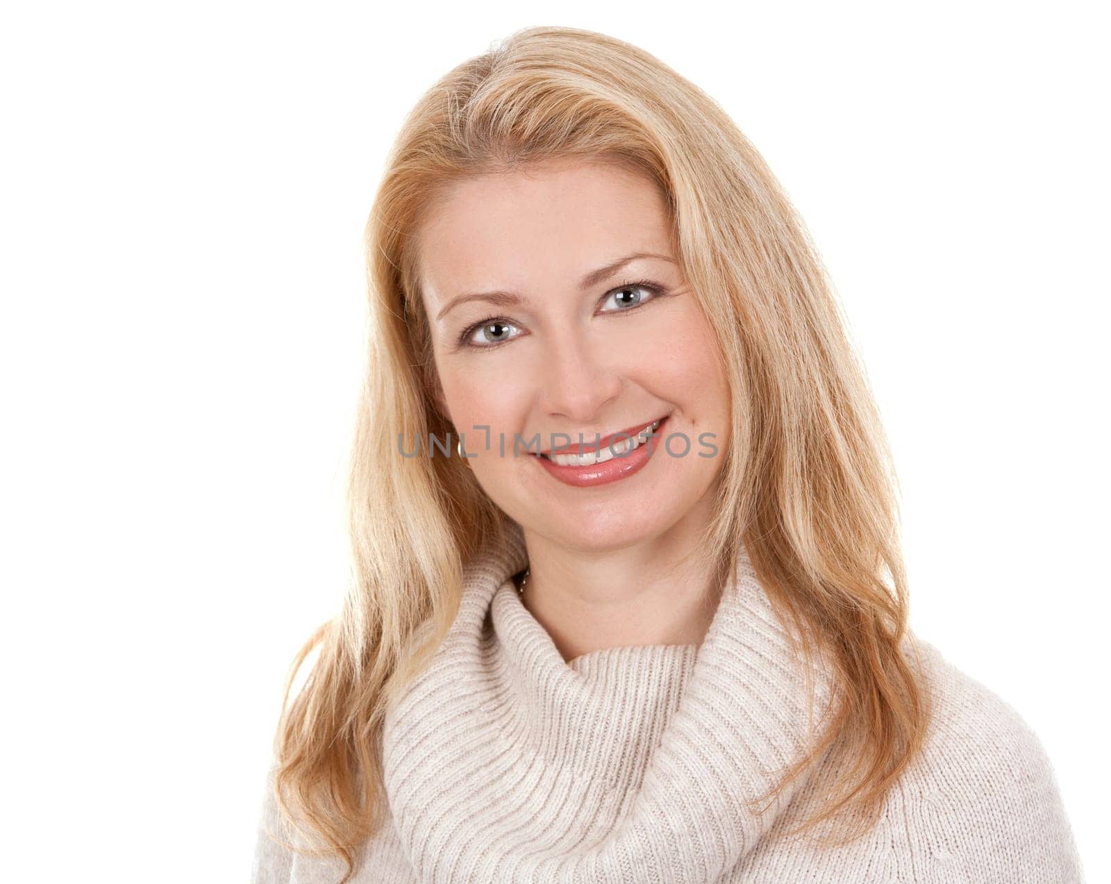pretty blond woman wearing beige sweather on white background