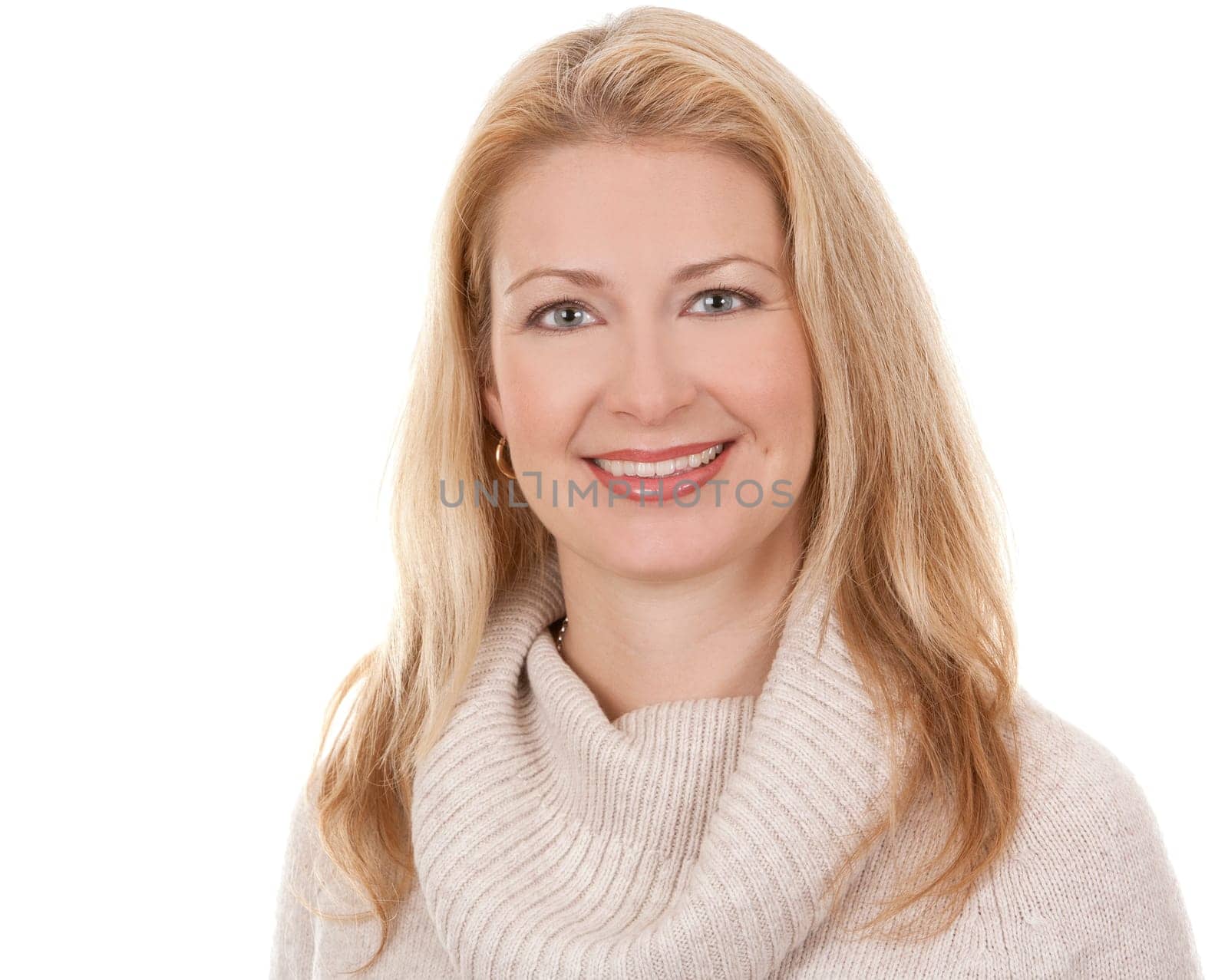 pretty blond woman wearing beige sweather on white background