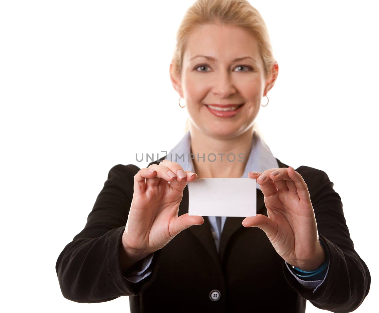 business woman in her 40s holding business card