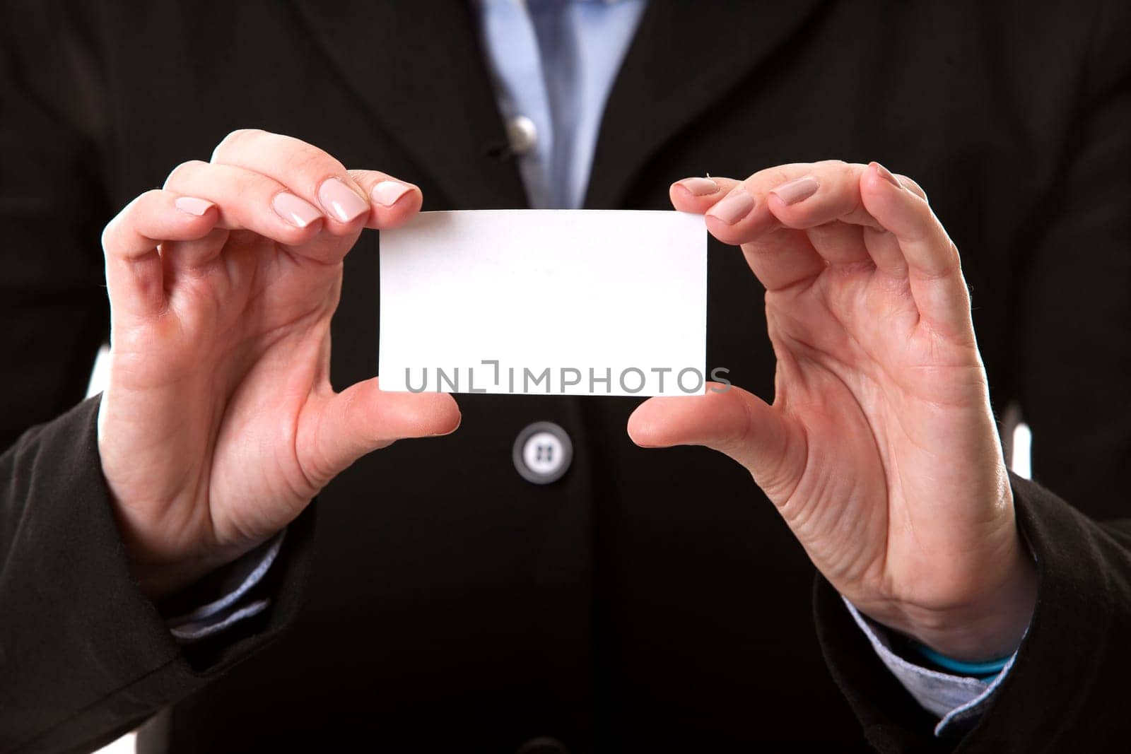 business woman in her 40s holding business card
