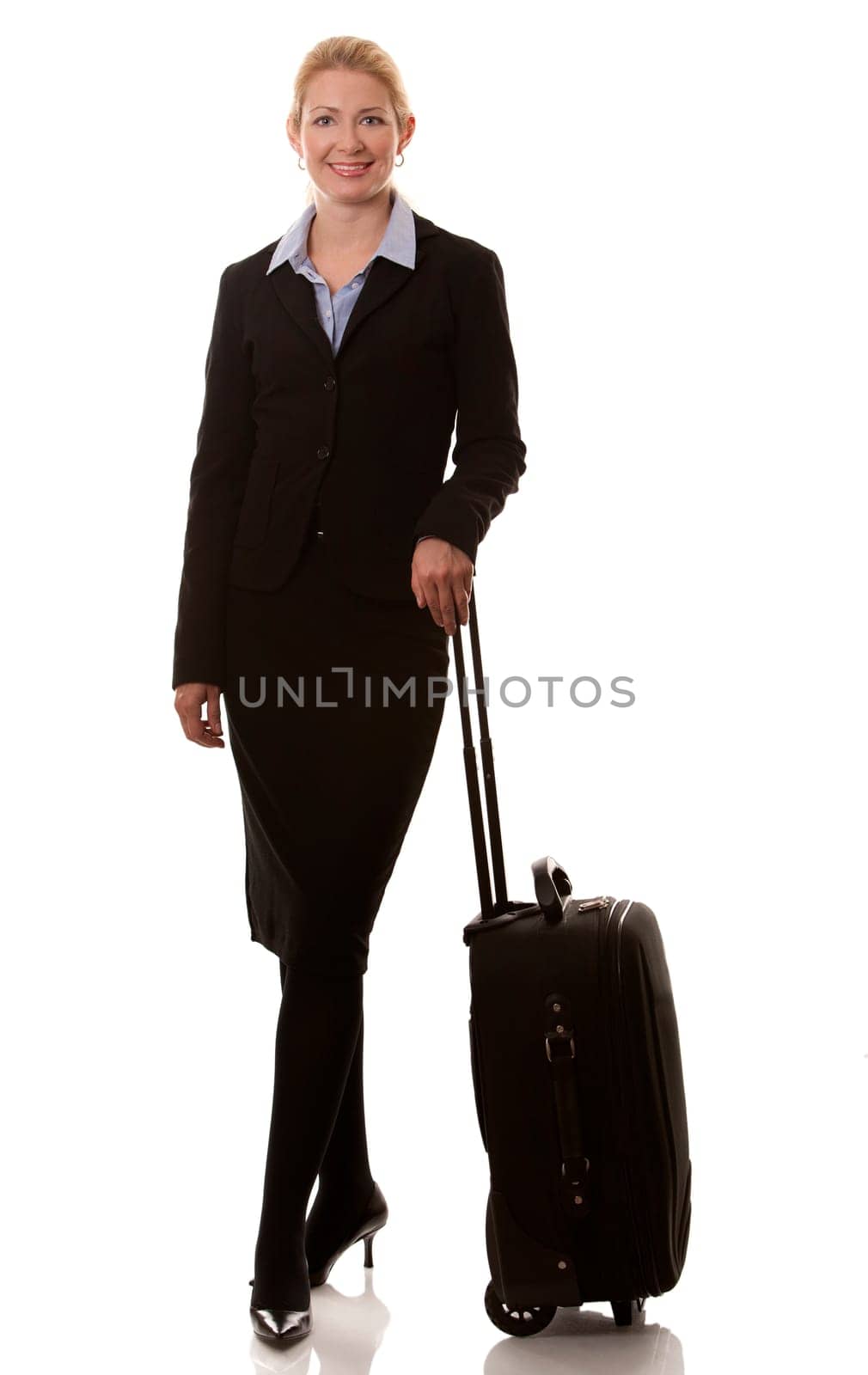 business woman in her 40s with suitcase on white background