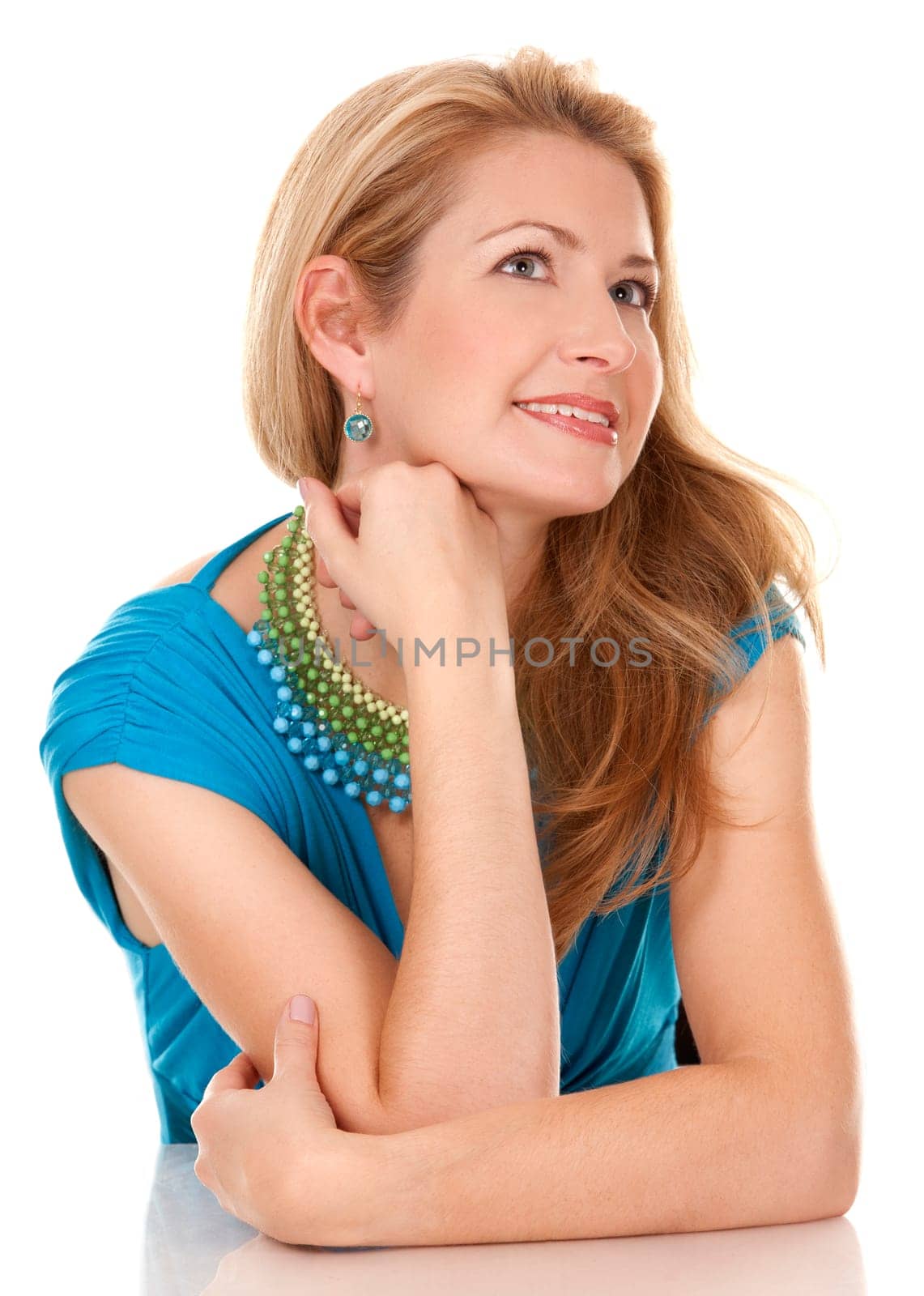 classy blond woman in her 40s wearing turquois dress