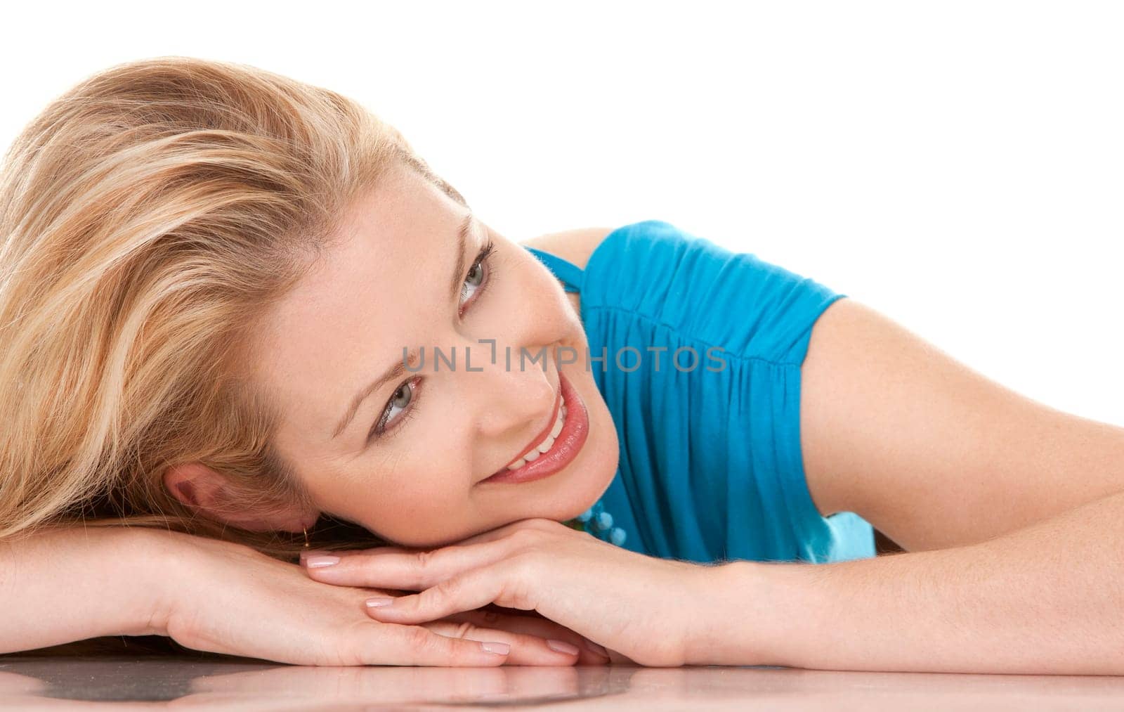 classy blond woman in her 40s wearing turquois dress