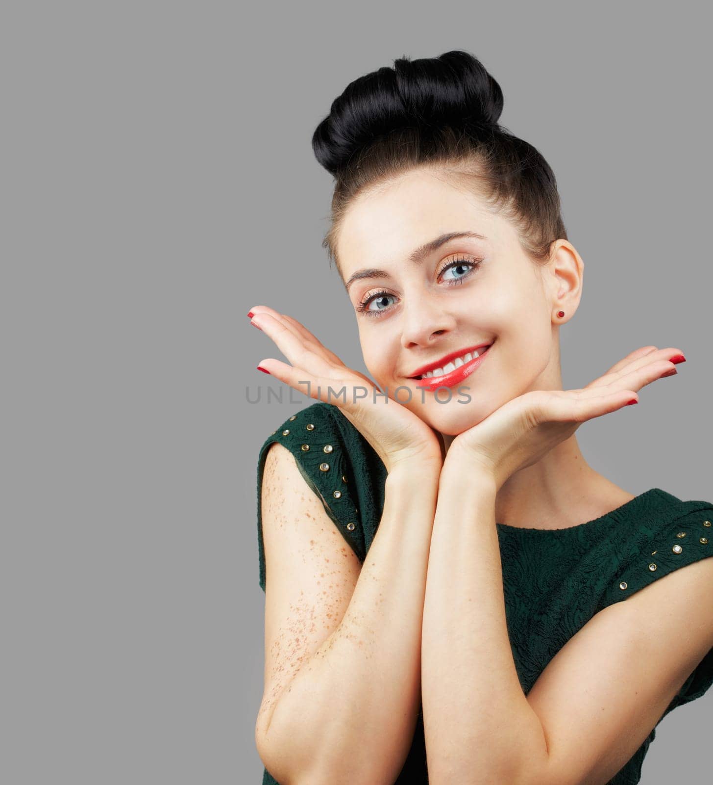 Portrait of a beautiful young woman with isolated on grey