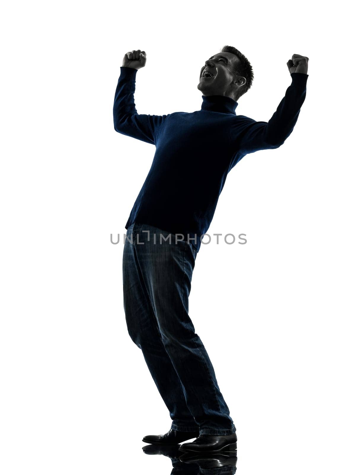 one caucasian man happy stong victorious full length in silhouette studio isolated on white background