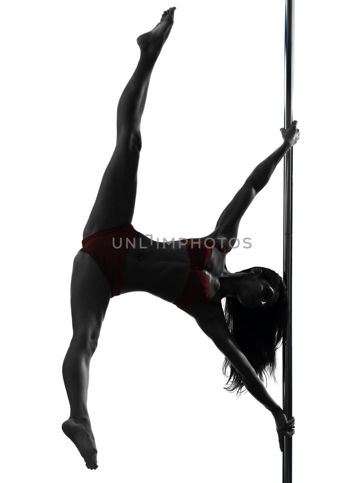 one caucasian woman pole dancer dancing in silhouette studio isolated on white background