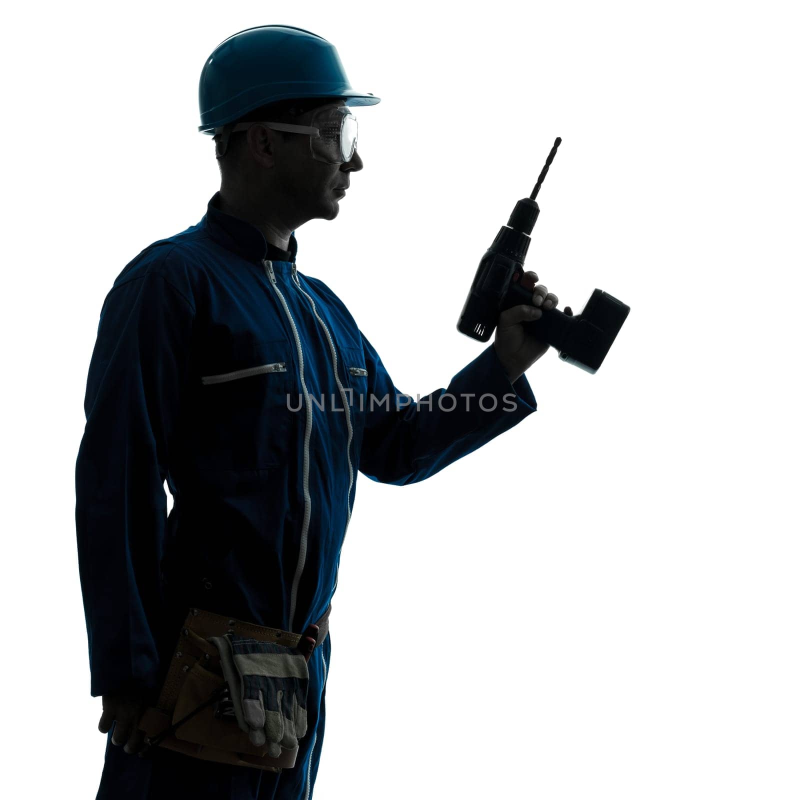 one caucasian man construction worker holding drill silhouette in studio on white background