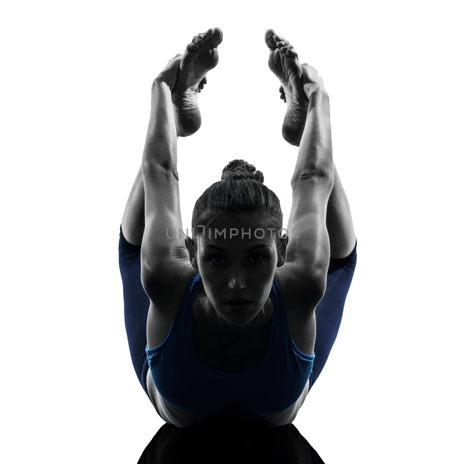 one caucasian woman exercising yoga  bow pose in silhouette studio isolated on white background