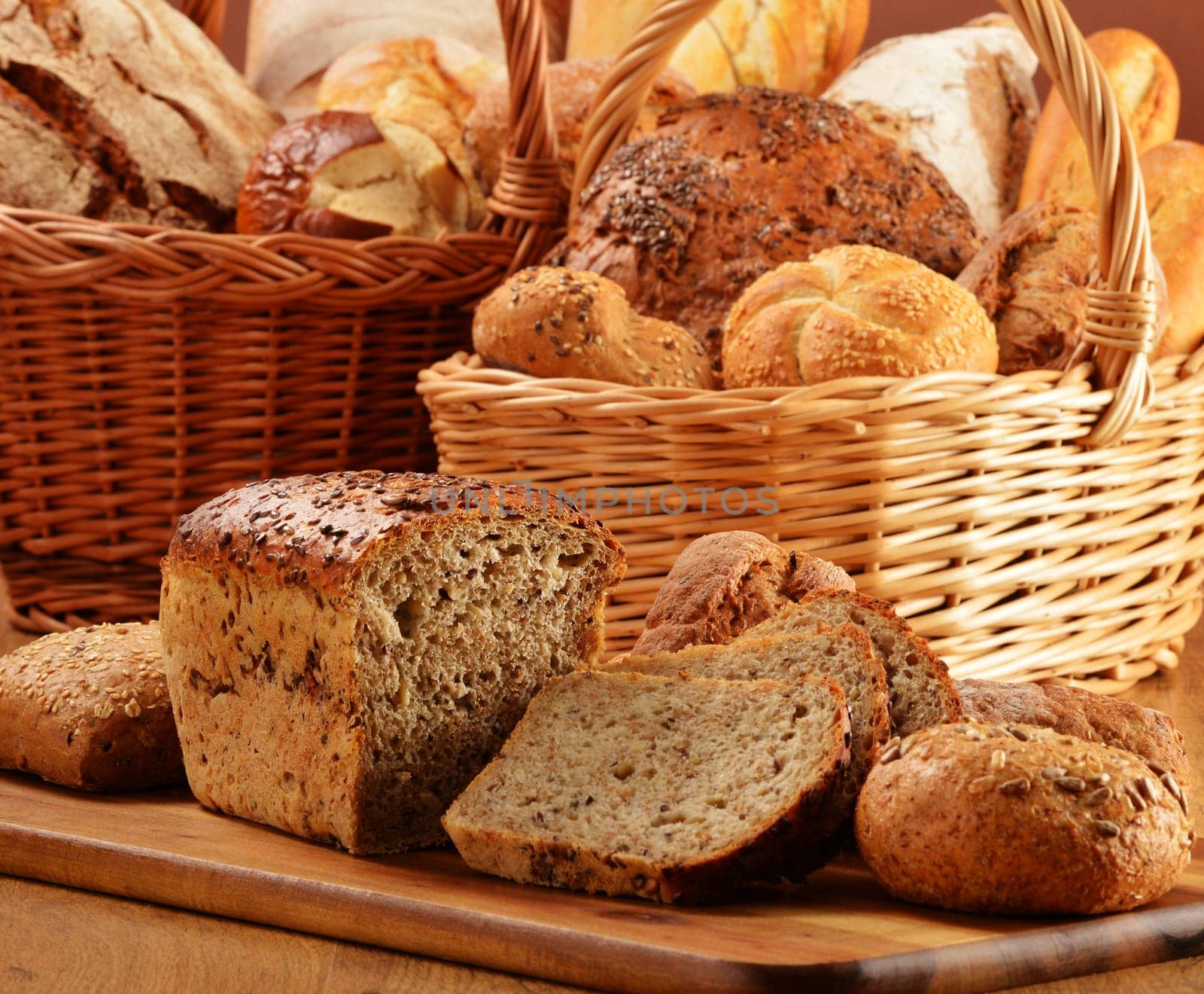 Composition with bread and rolls in wicker basket
