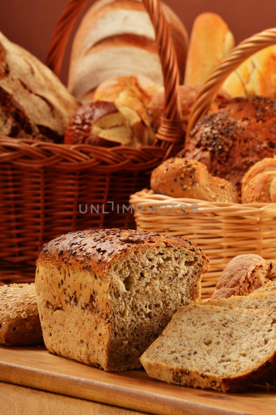 Composition with bread and rolls in wicker basket