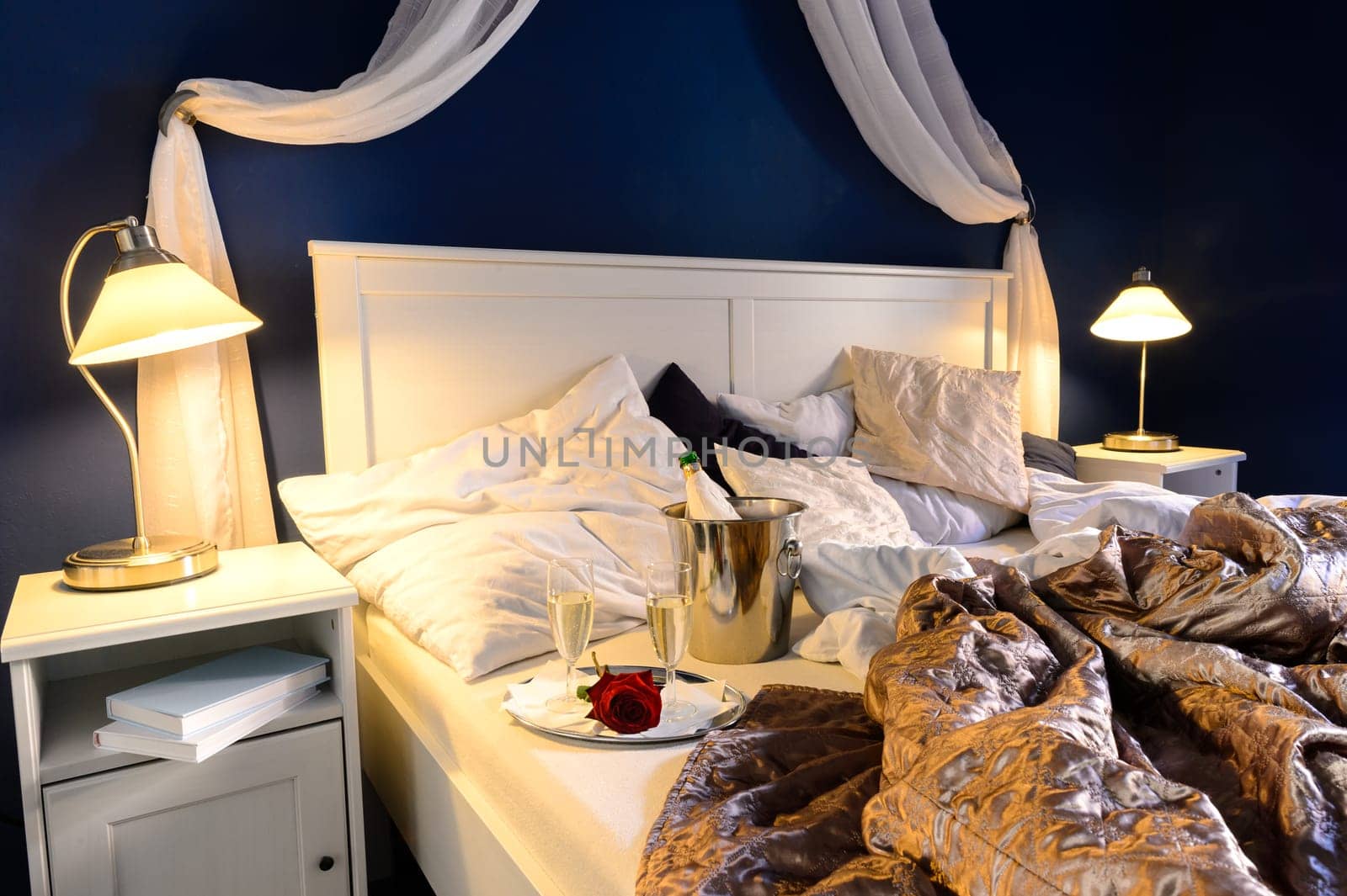 Rumpled sheets luxury hotel bedroom romantic night unmade bed