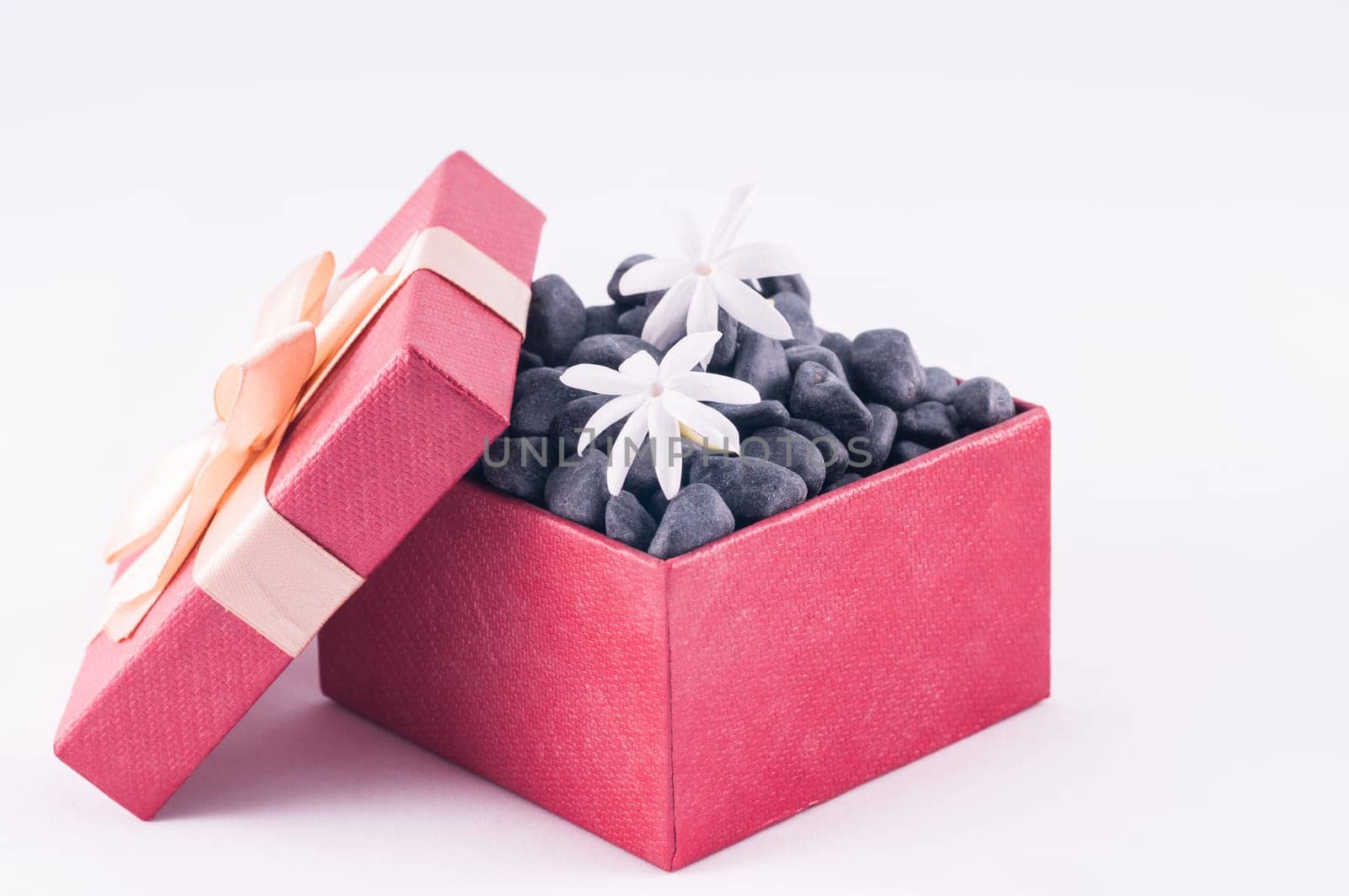 Spa concept - a gift of wellness with black zen stones
