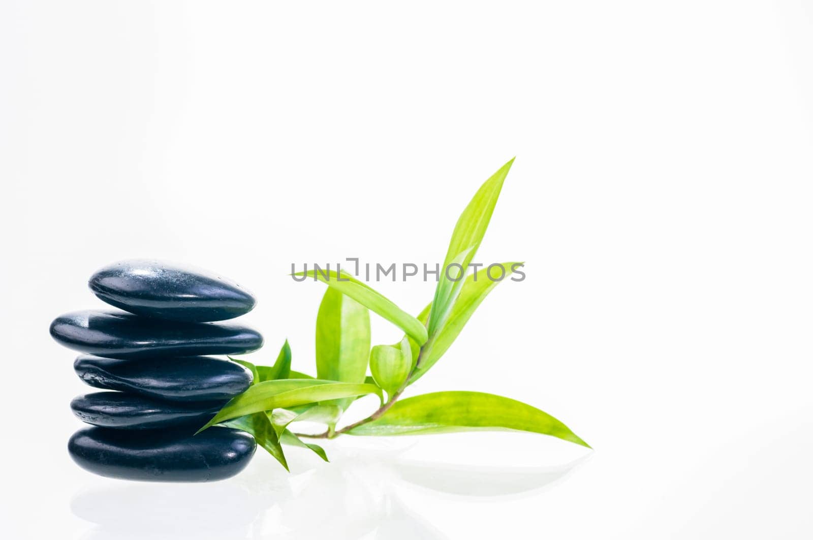 Black balanced zen stones with bamboo