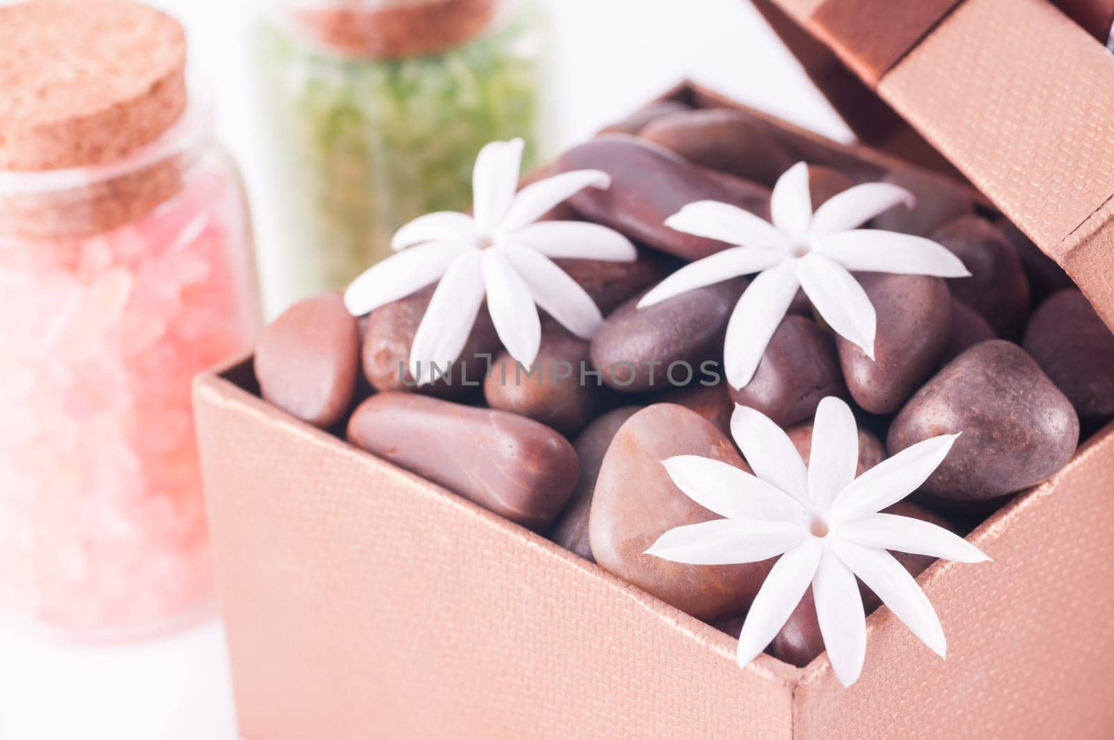 Spa concept - a gift of wellness with red zen stones