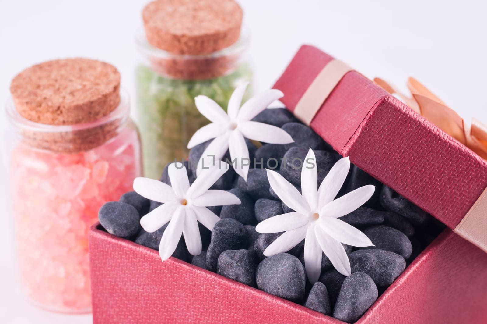 Spa concept - a gift of wellness with black zen stones