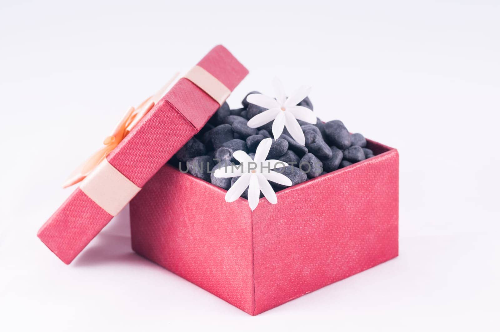 Spa concept - a gift of wellness with black zen stones