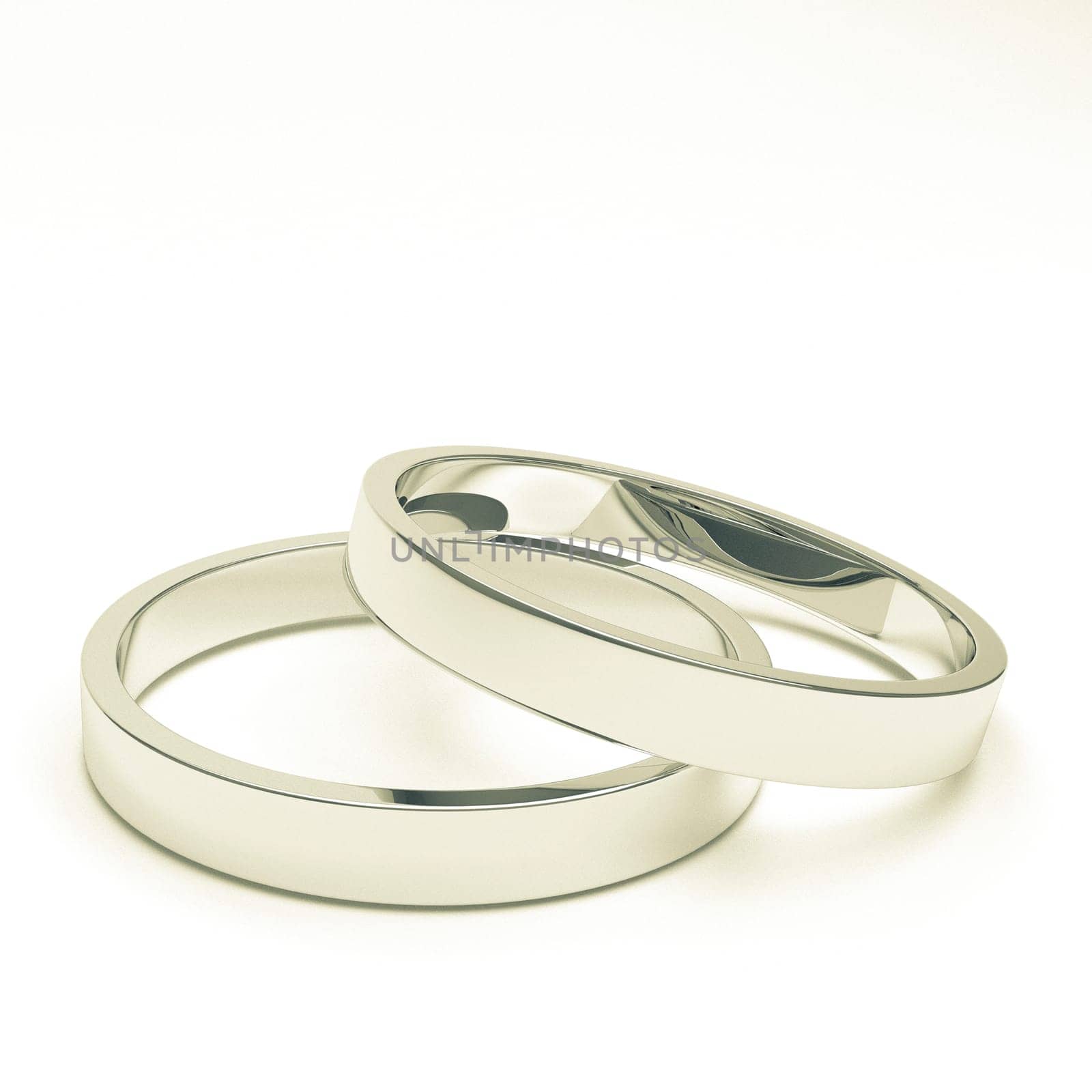 A pair of isolated silver or platinum weddings rings.