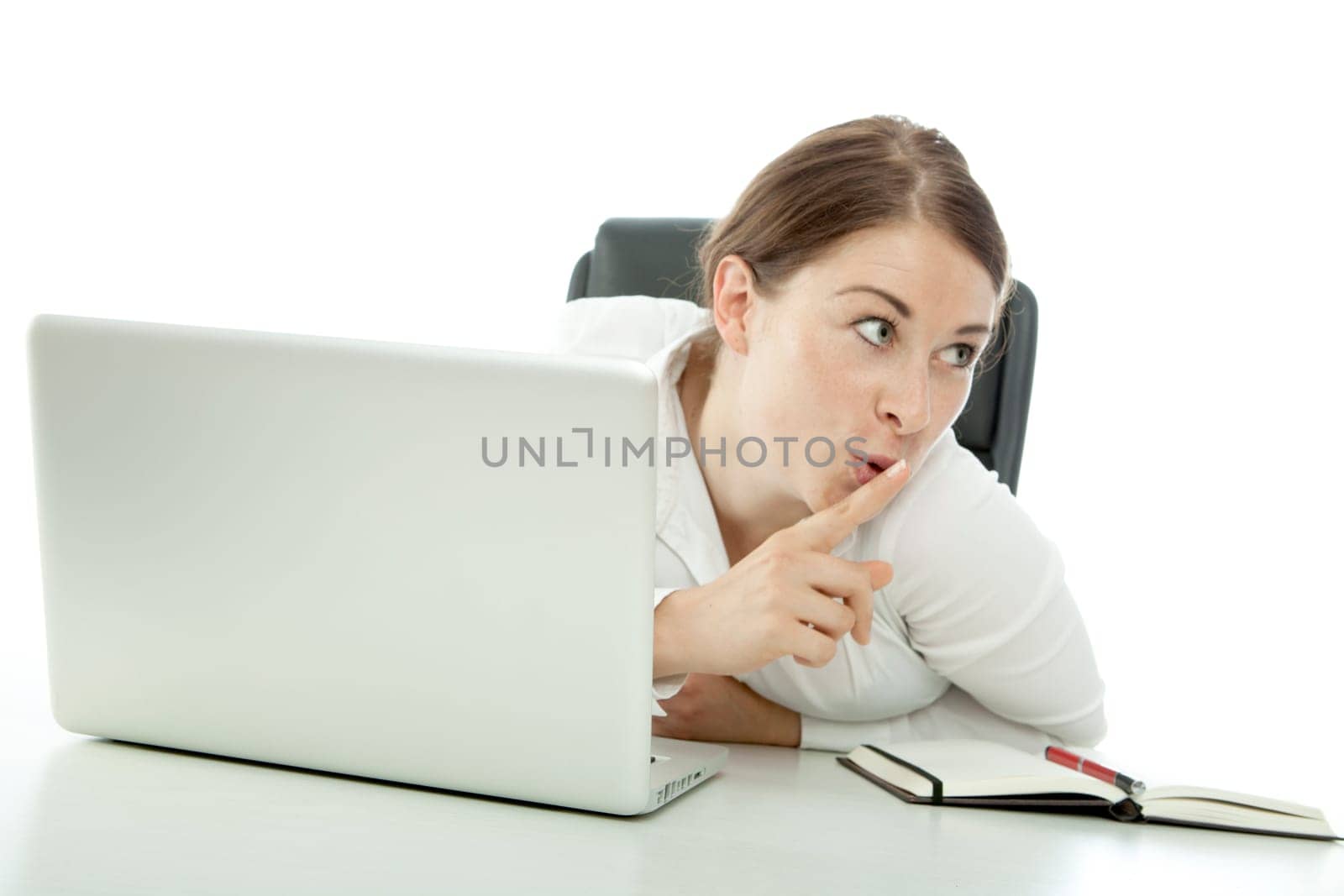 brunette young woman holding finger mouth sign quiet