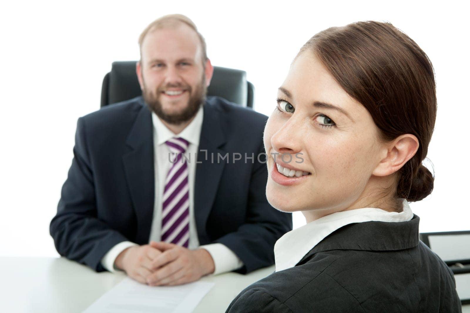 beard business man brunette woman at desk smile