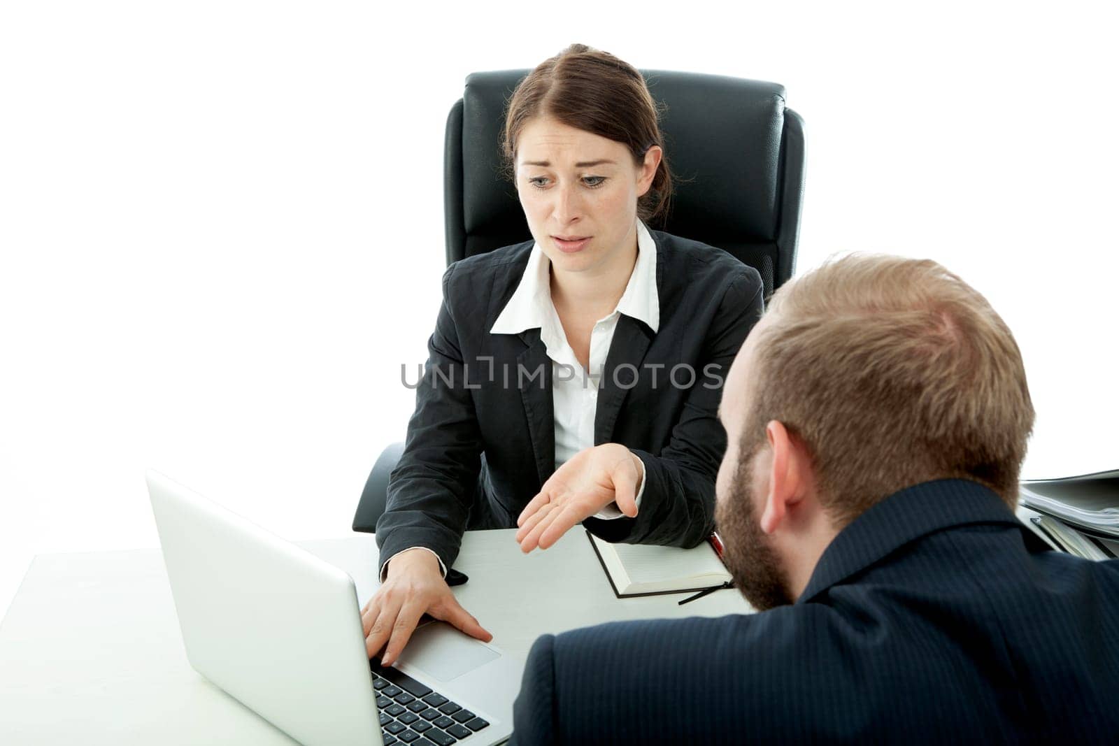 beard business man brunette woman at desk worry about laptop news