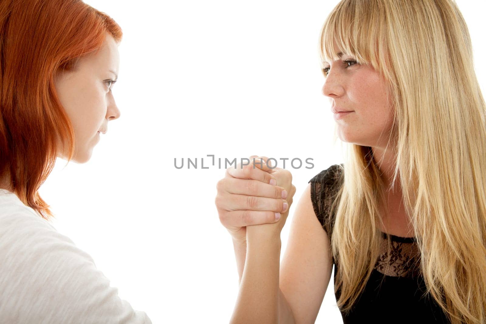 young beautiful red and blond haired girls in front of white background