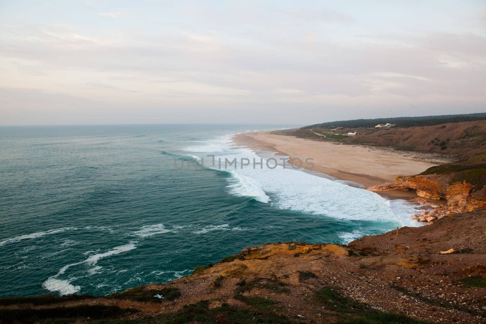 Scenic view of surf beach and ocean near Nazare Portugal
