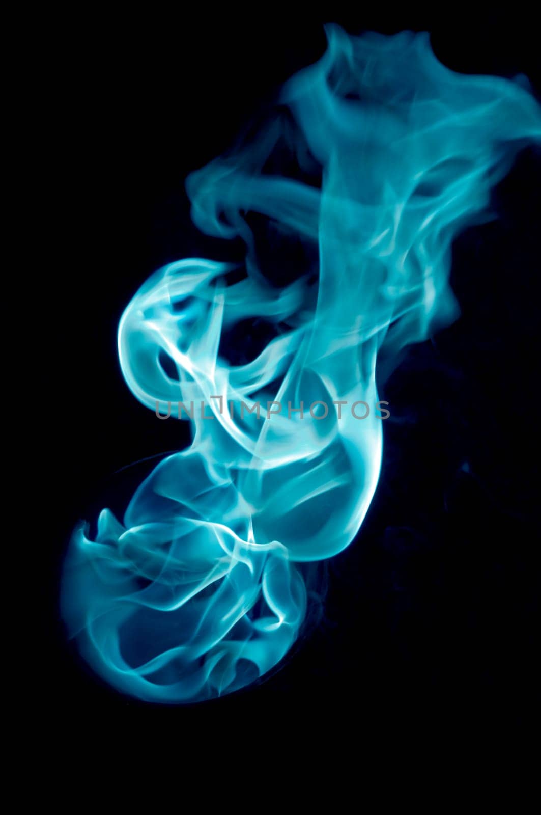 bluish fire with a black background, abstract background.