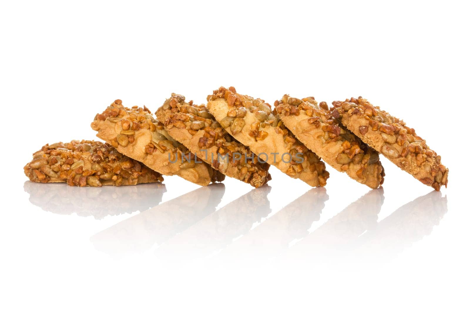 Cookies with sunflower seeds on the white background