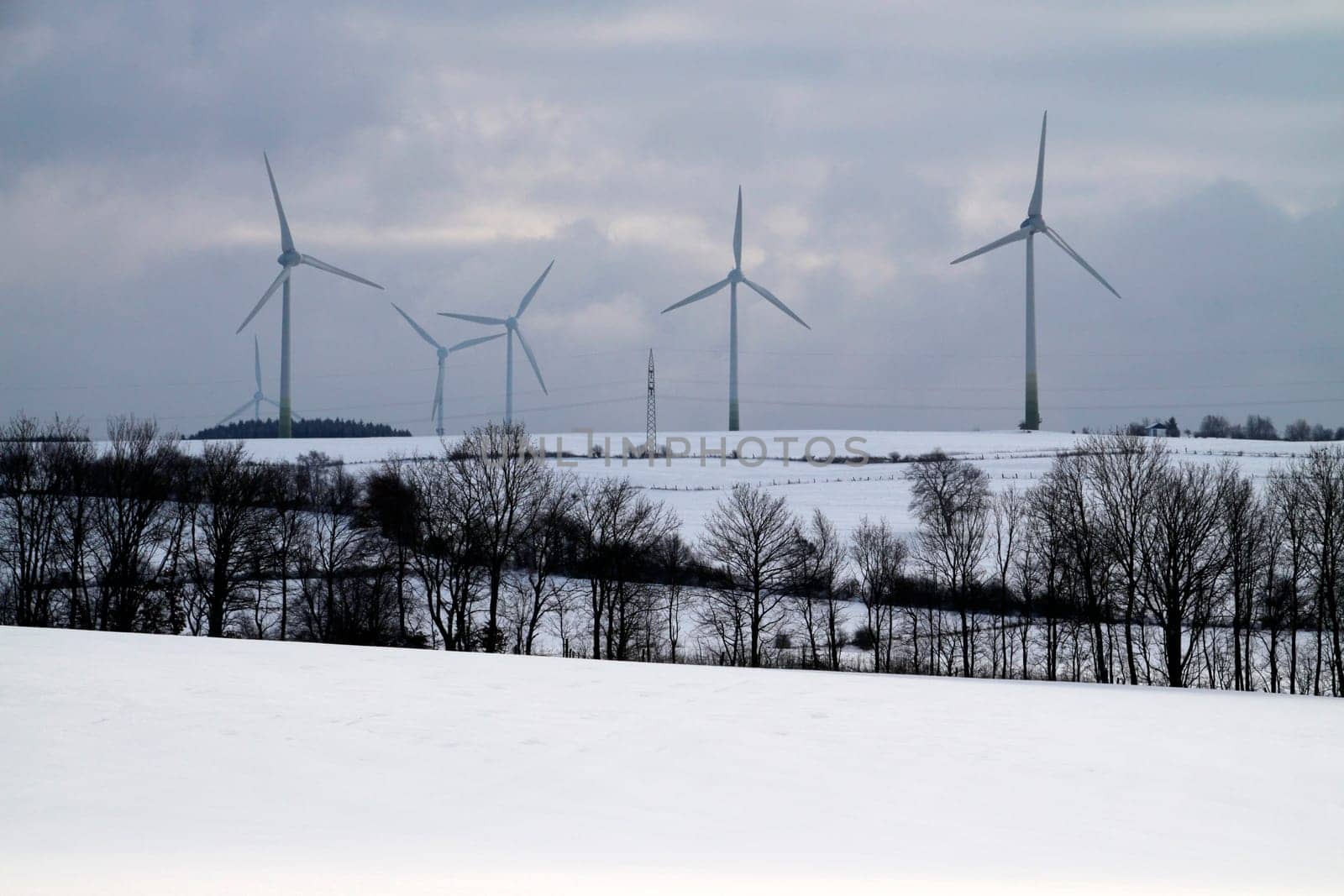 Winter landscape with wind turbine