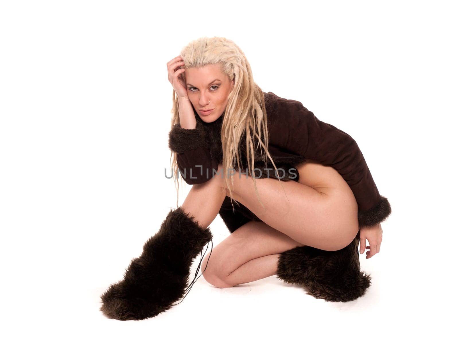 Beautiful girl dressed in furs with long legs