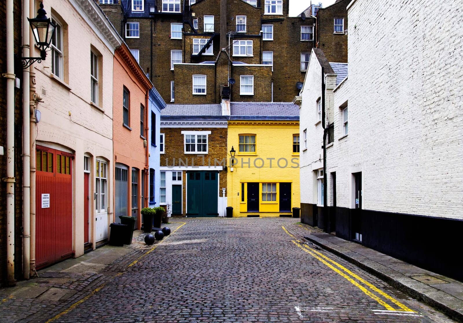 Cobbled street and colorful brick houses in London, England, UK