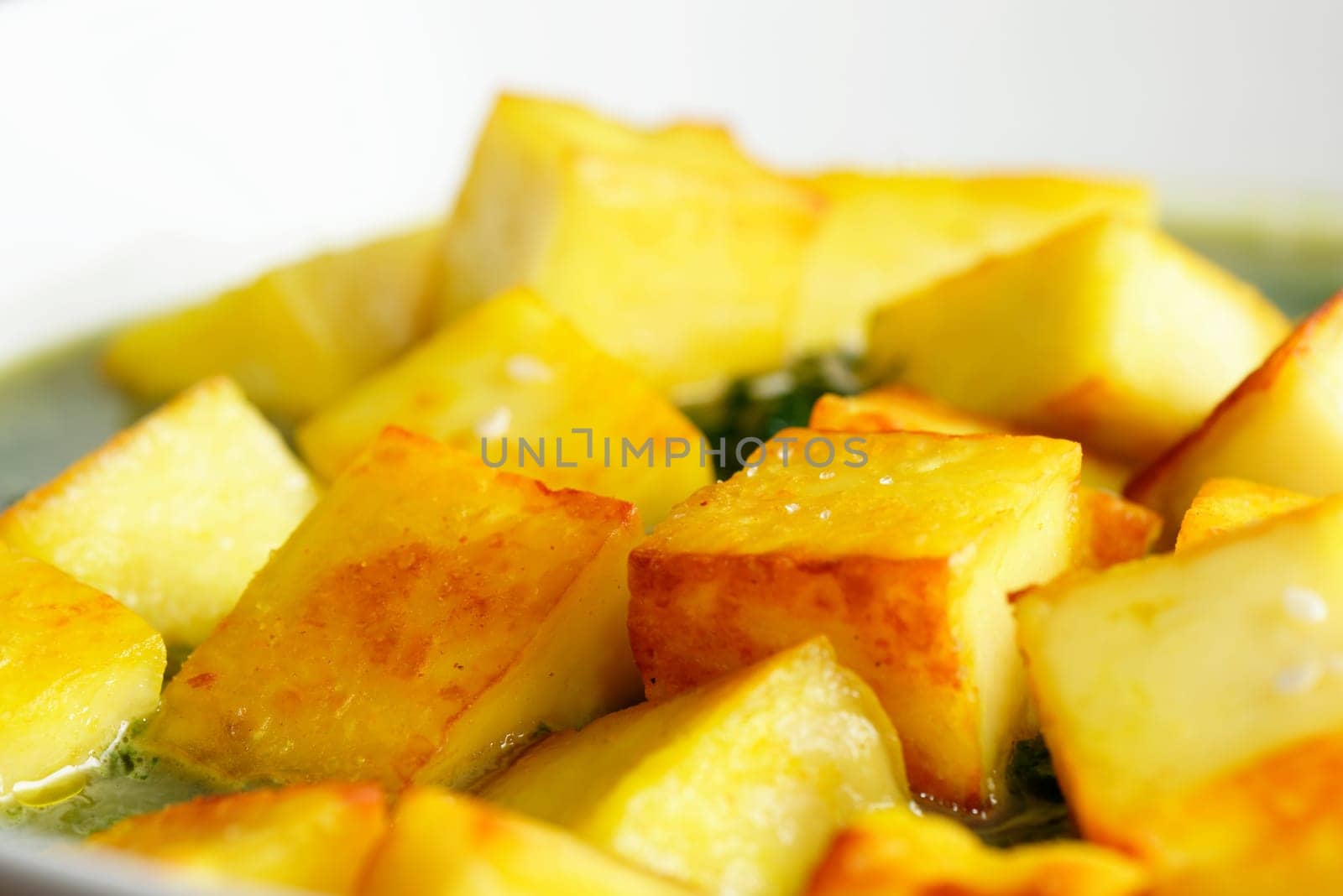 Fried paneer with sesame seed and spinach