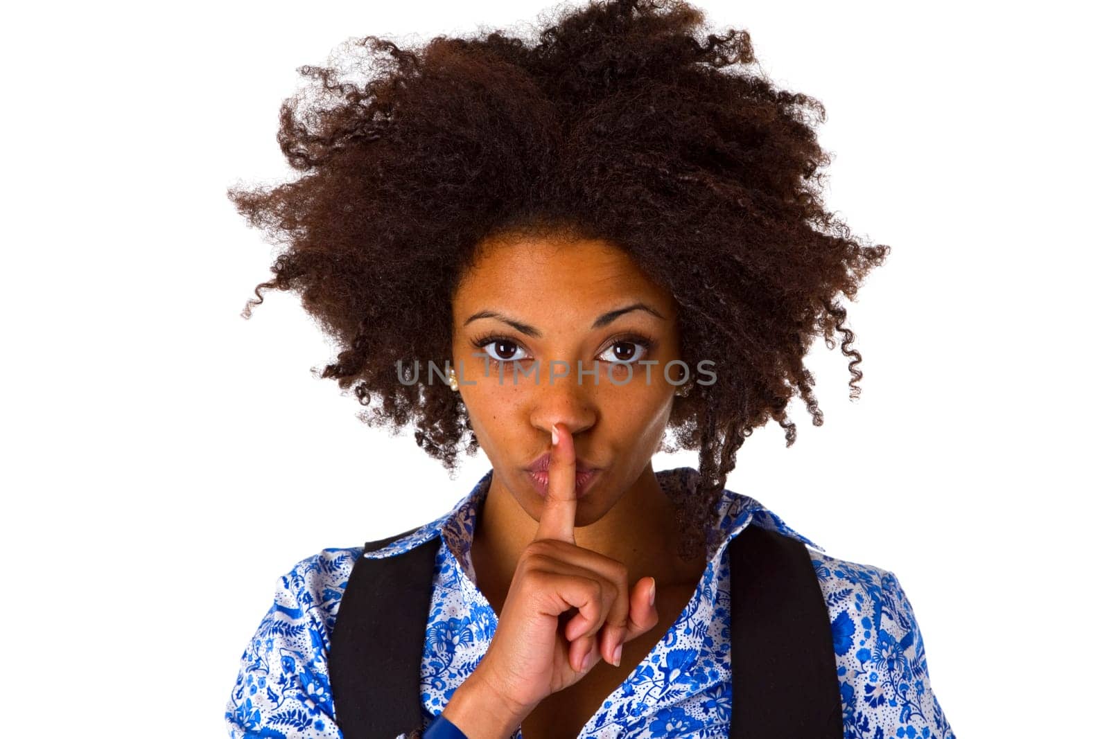 Young African-American woman holding index finger in front of her mouth - isolated on white background