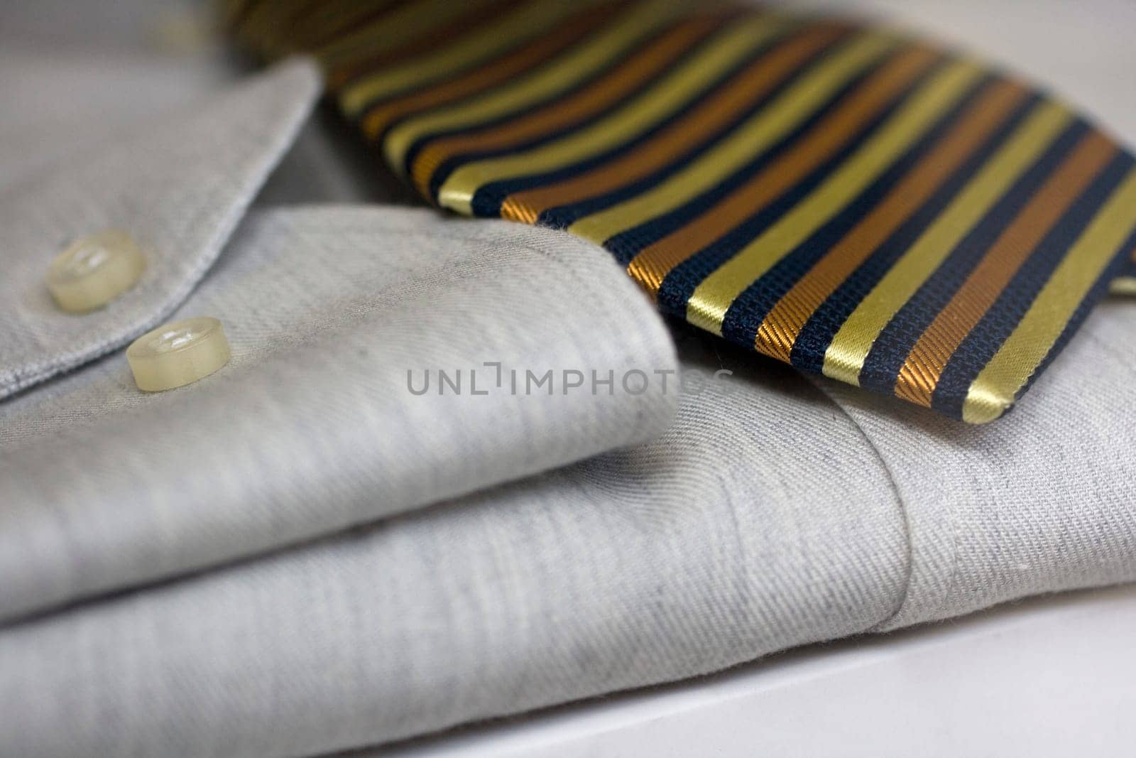 Close up of elegant Striped tie on gray shirt