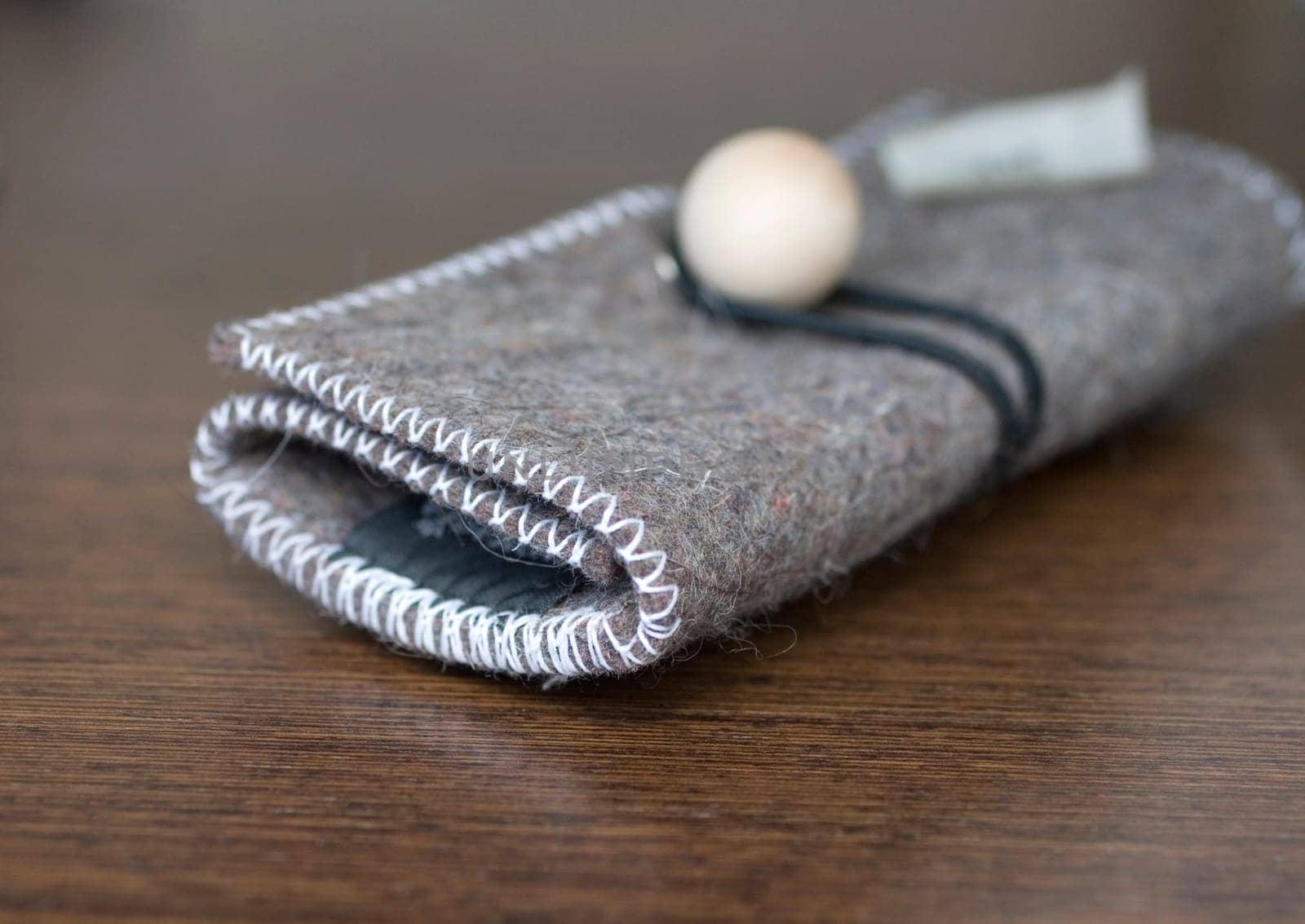 Felt coin purse on a wood
