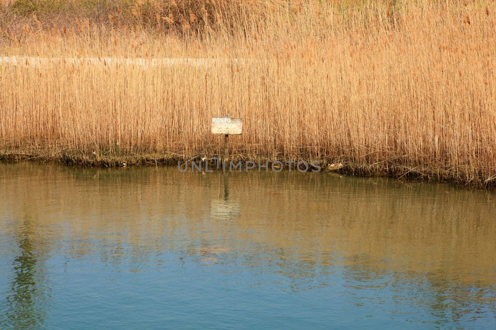 Sign on the river bank marked "Mooring busy"""