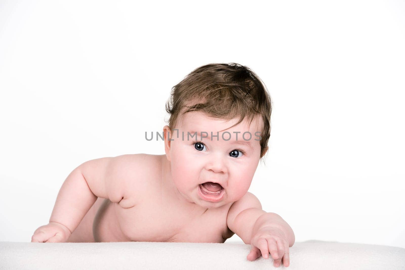baby is looking in to the camera