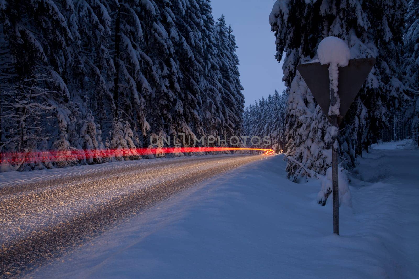 Car traffic in ice and snow in the night