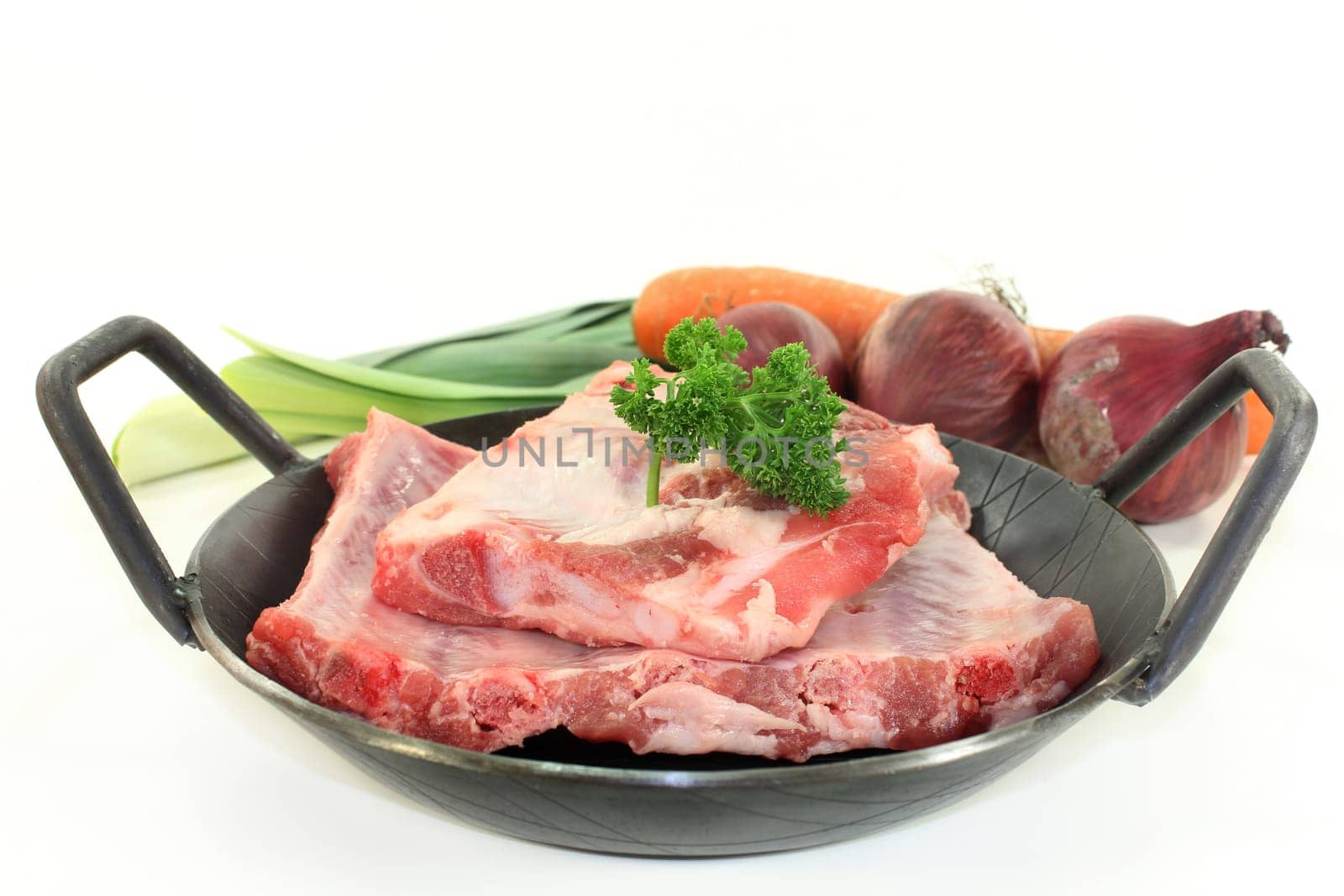 two pieces of peeled ribs against a white background