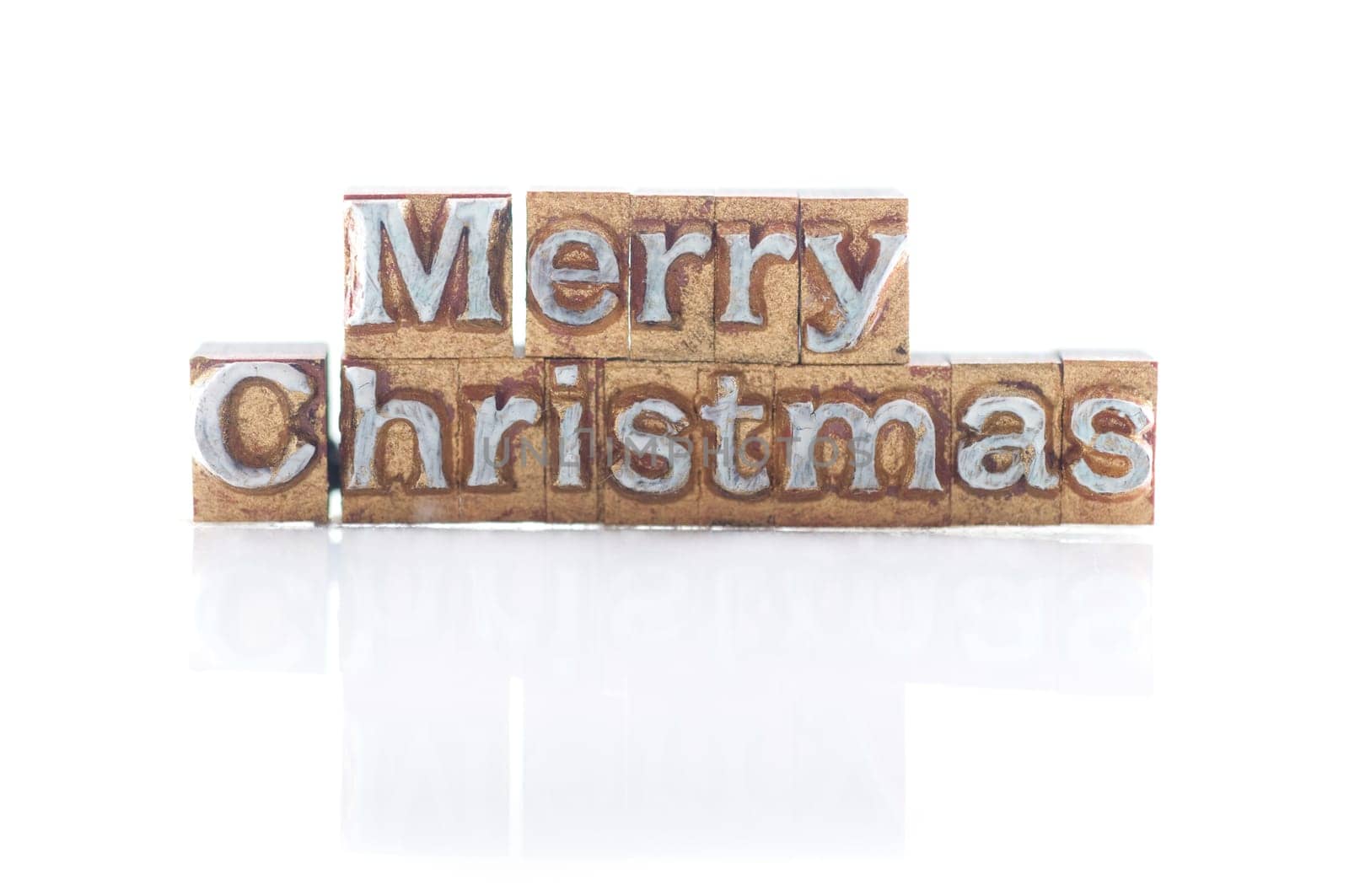 The phrase "Merry Christmas"" done in letterpress type"